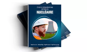 Couverture de livre avec un travailleur et une centrale nucléaire.